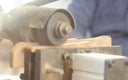 Wooden pieces taking on the form of fan sticks.