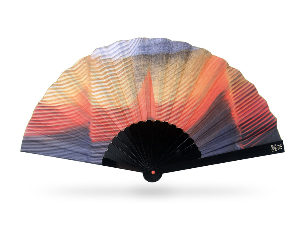 Khu Khu Kingfisher Premium Tropical Bird Wing Print Hand-Fan in orange and gold tones. Painted and then printed onto high grade cotton with swiss acrylic bespoke shape black sticks. Orange rivet and gold rim. Engraved logo. 
