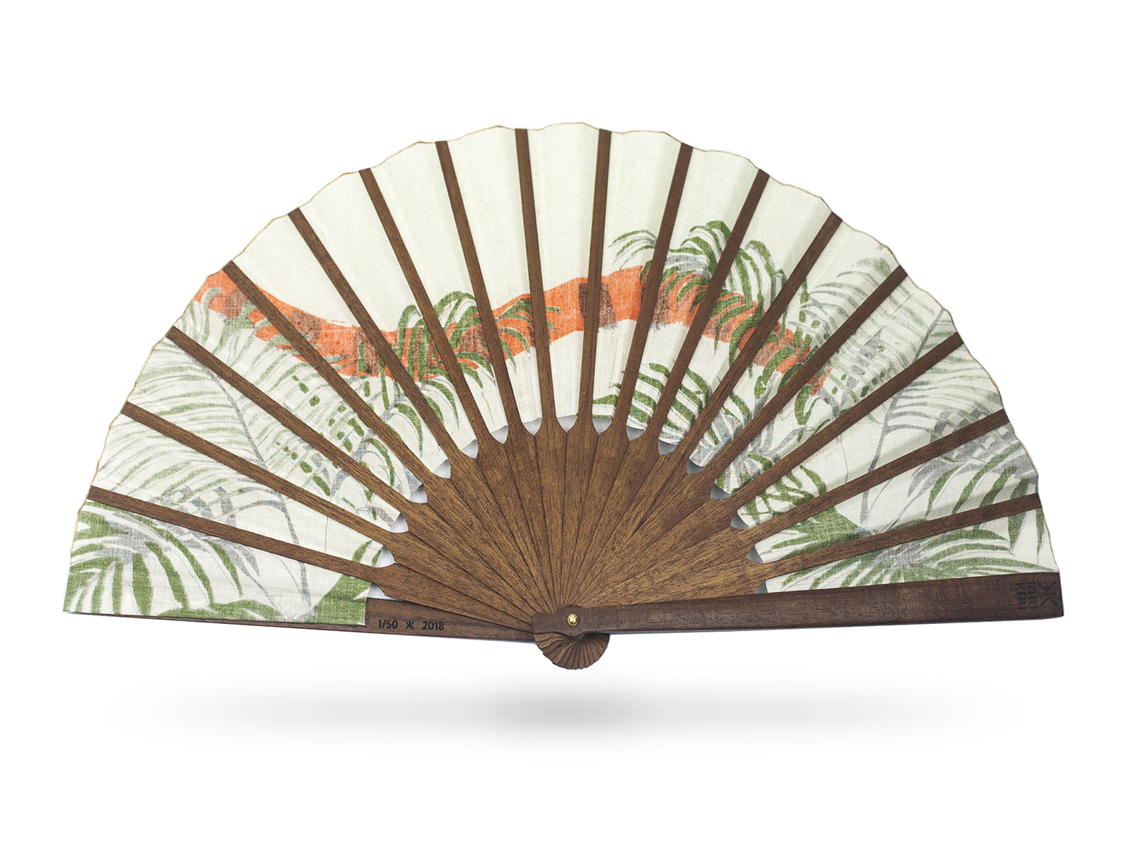 View of the back of Khu Khu Indian Tiger luxury hand-fan. Hand screen printed orange and black Indian Tiger tail swishes through tropical green fern leaves with cream background mounted with premium cherry wood in exclusive Khu Khu shape with polished brass rivets. .